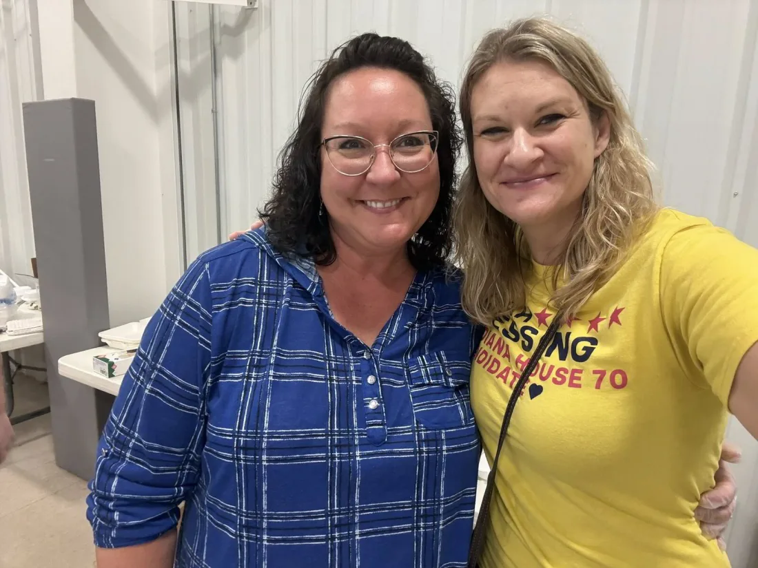Sarah Blessing talking with a neighbor at a community event